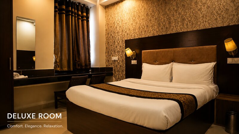 Clean and modern Deluxe Room at Hotel The Black Gold with a 32-inch TV.